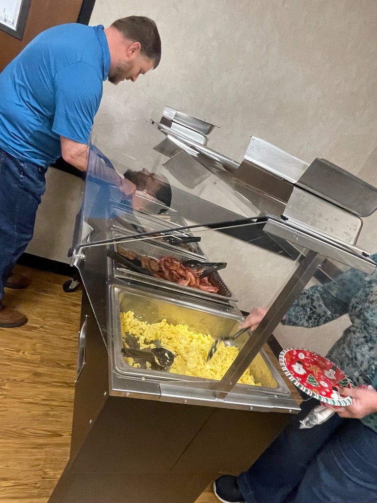 staff getting breakfast buffet items