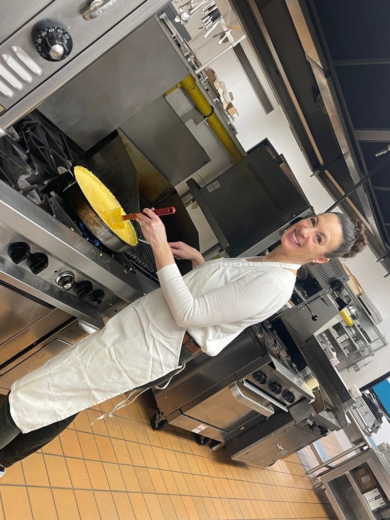 Mrs. Kennedy making up scrambled eggs