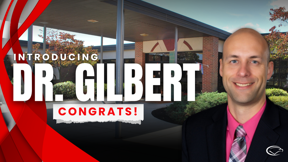 Red, black, and gray graphic with text 'Introducing Dr. Gilbert. Congrats!' over image of Silver Spring Elementary Principal David Gilbert with a building image in the background.