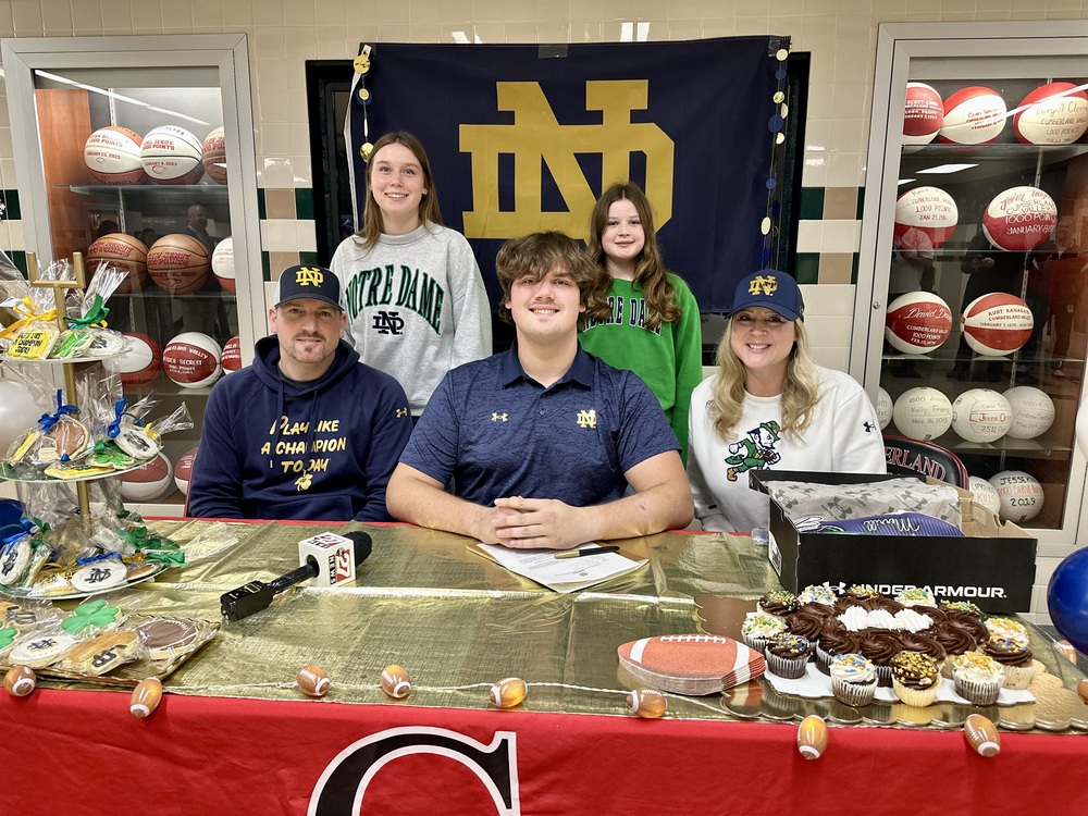 CV Senior Football player poses with his family while signing is National Letter of Intent to play football at the University of Notre Dame.