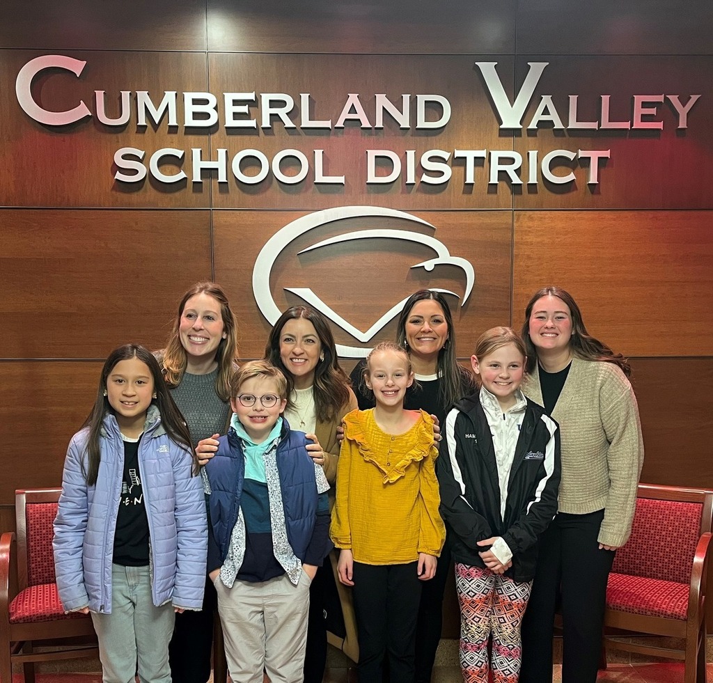 4th grade Silver Spring students read poems on adaptability at a Board Meeting