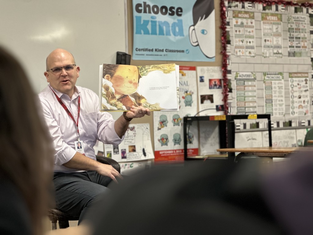 Administrators participate in World Read Aloud Day at Eagle View Middle School.
