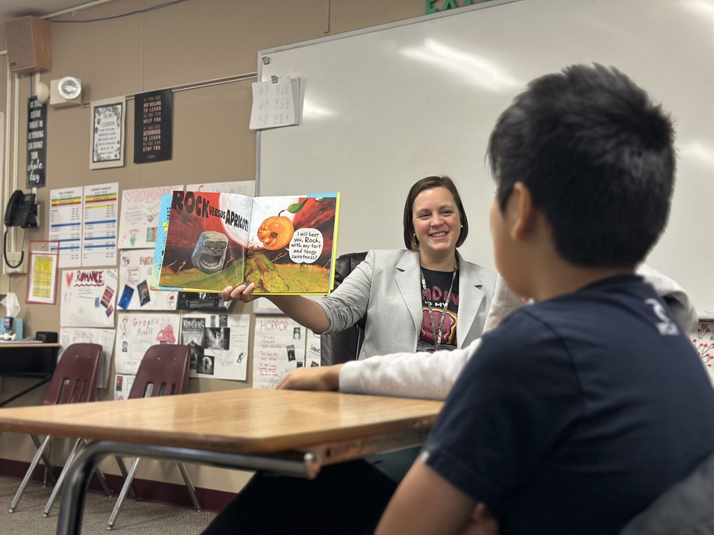 Administrators participate in World Read Aloud Day at Eagle View Middle School.