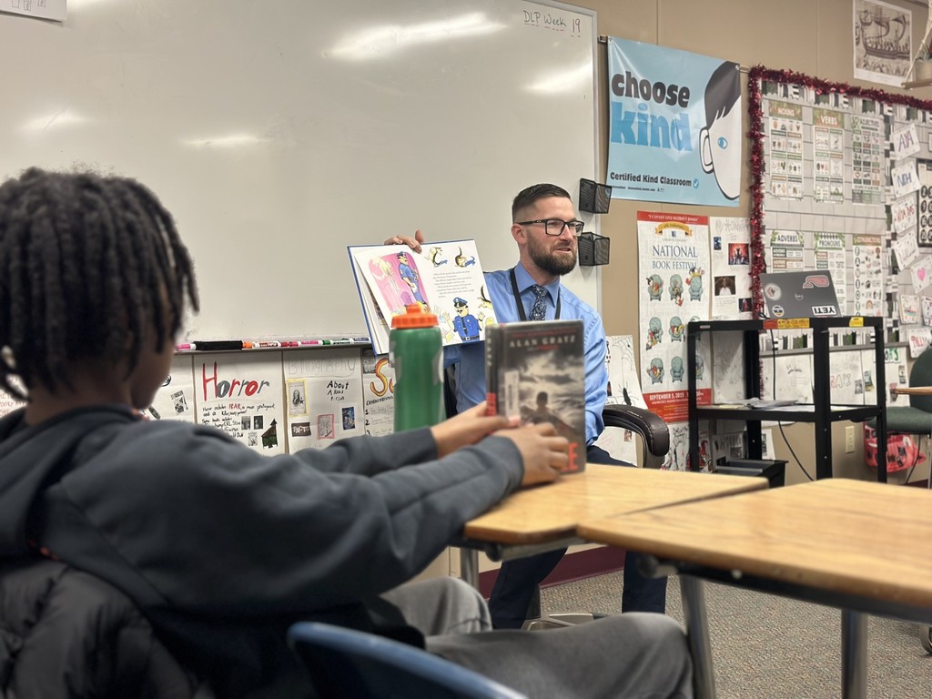 Administrators participate in World Read Aloud Day at Eagle View Middle School.