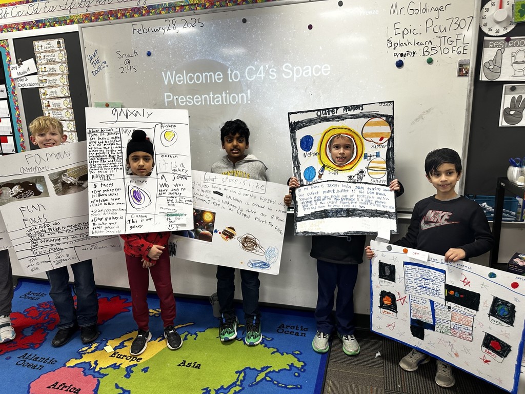 Third-grade students at Silver Spring Elementary show off their space projects.