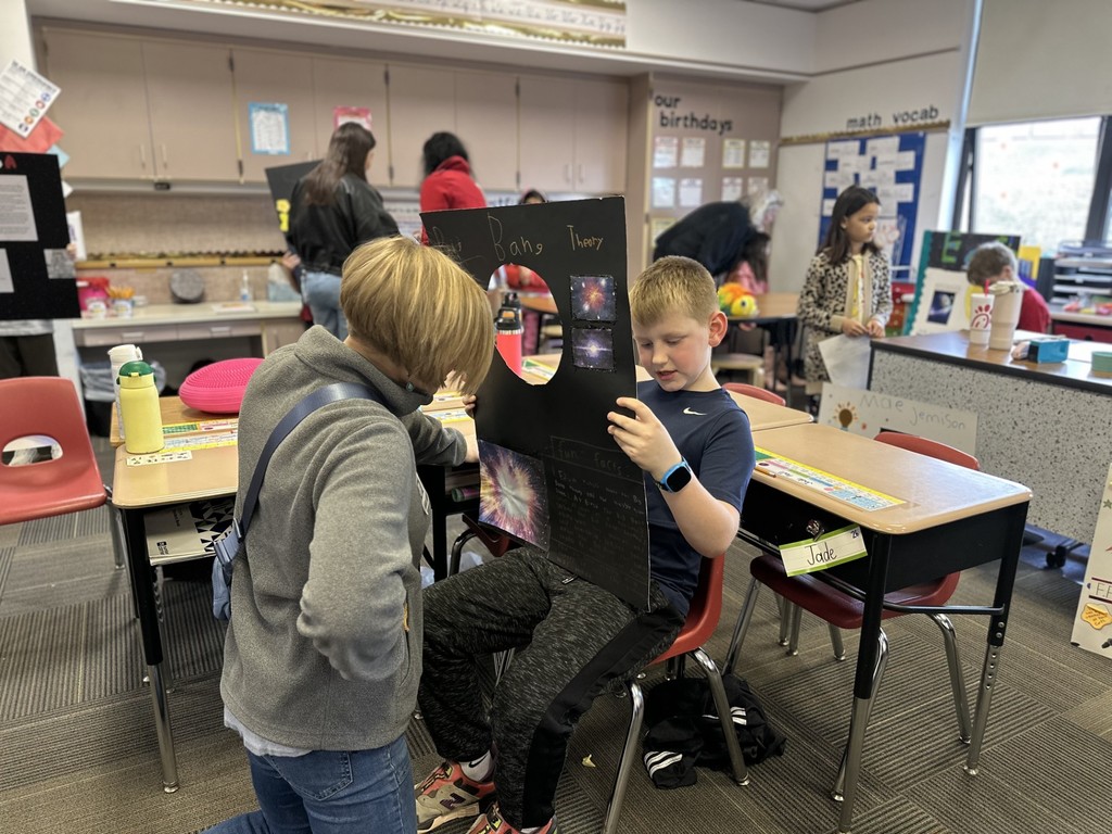 Third-grade students at Silver Spring Elementary show off their space projects.
