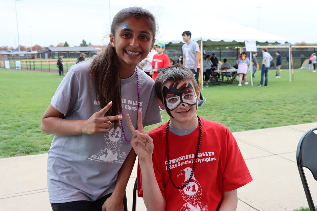 CVHS student volunteer shows off her face painting skills on a student-athlete during CV's Special Olympics.