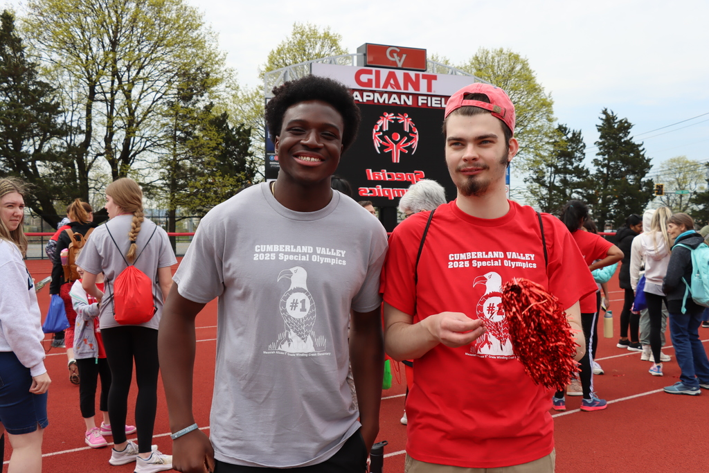 Student volunteer smiles with his student-athlete buddy during CV's Special Olympics.
