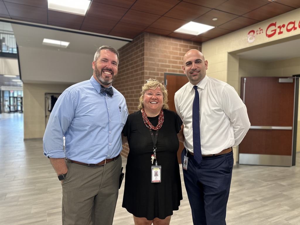 Mountain View Middle School admin team standing in hallway near 8th grade area.