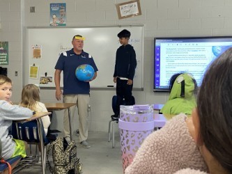 Mr. Hennessey demonstrating with student