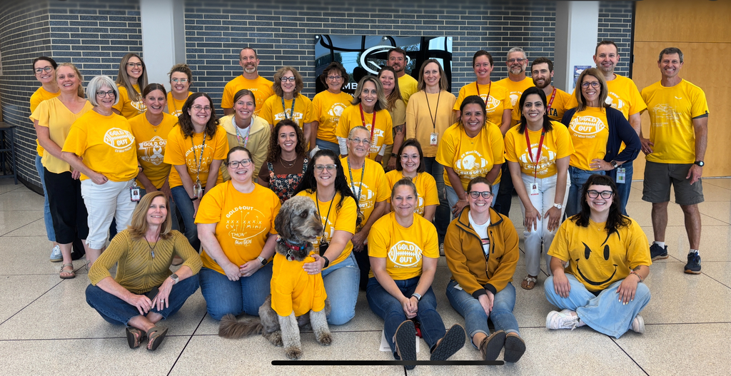 CV9 staff wearing yellow Mini-THON Gold Out shirts pose together in support of Childhood Cancer Awareness Month.