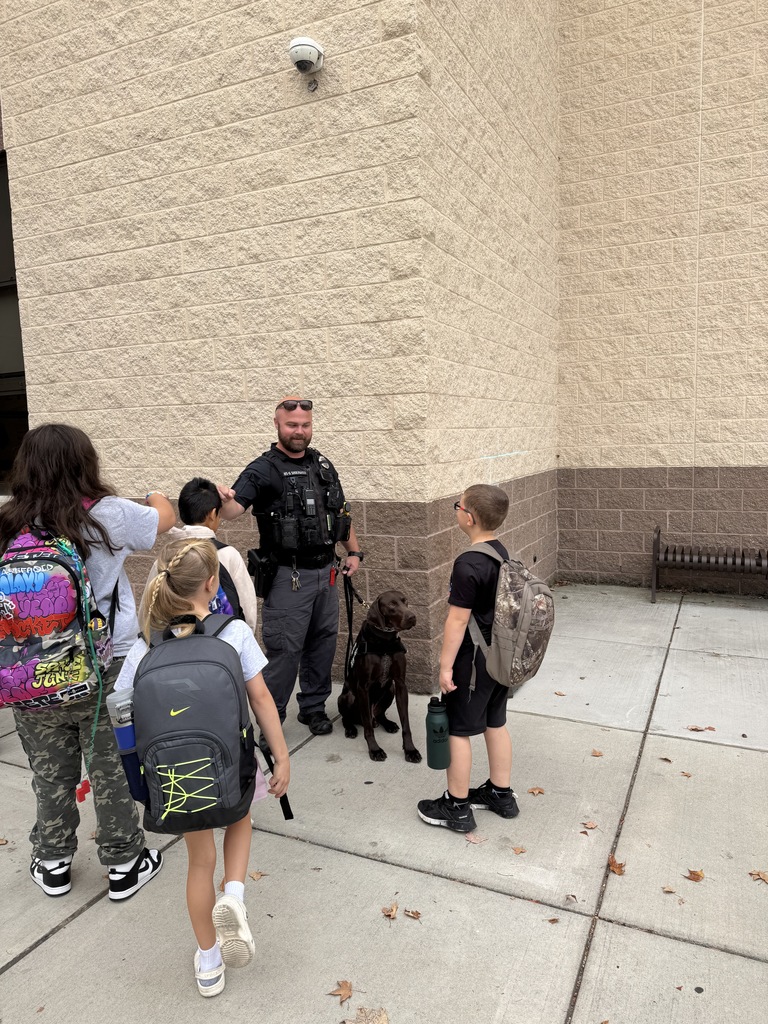 CVSD Officer Shoemaker and K-9 dog, Zoro, great students outside of Middlesex Elementary School.