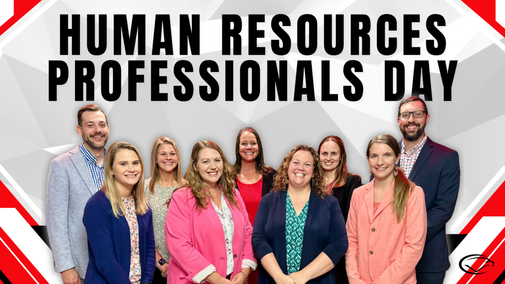 Group of people standing under a 'Human Resources Professionals Day' banner.
