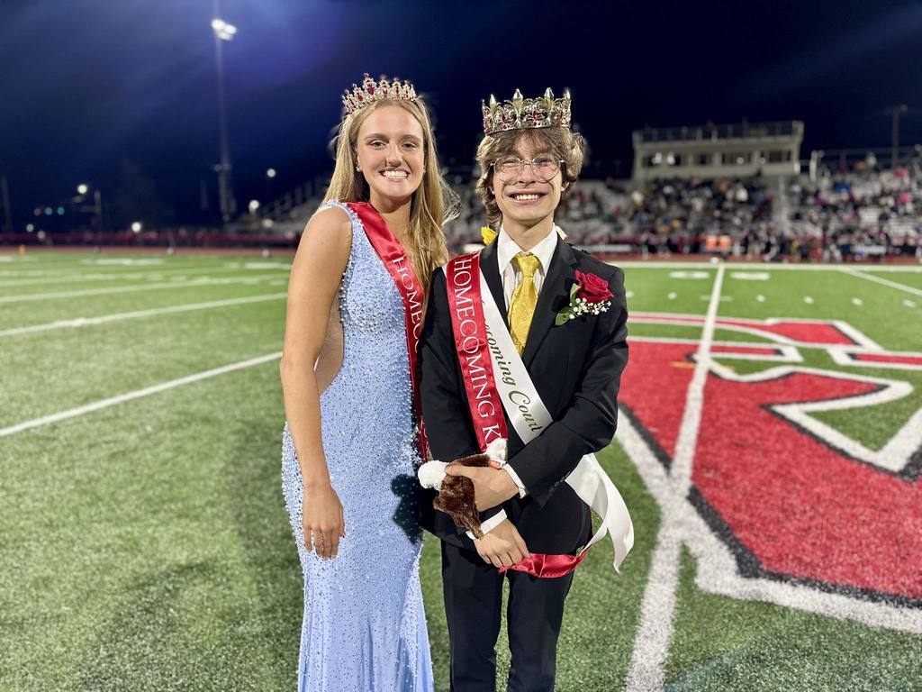 2025 Cumberland Valley High School Homecoming Queen, Mary Boone, and King, Justin Tomaine, stand on the 50-yard line at Chapman Field.