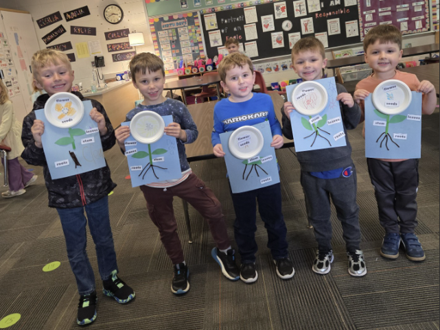 Male students show plant diagrams