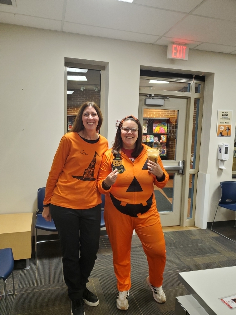 Two female teahcers wearing Halloween clothing