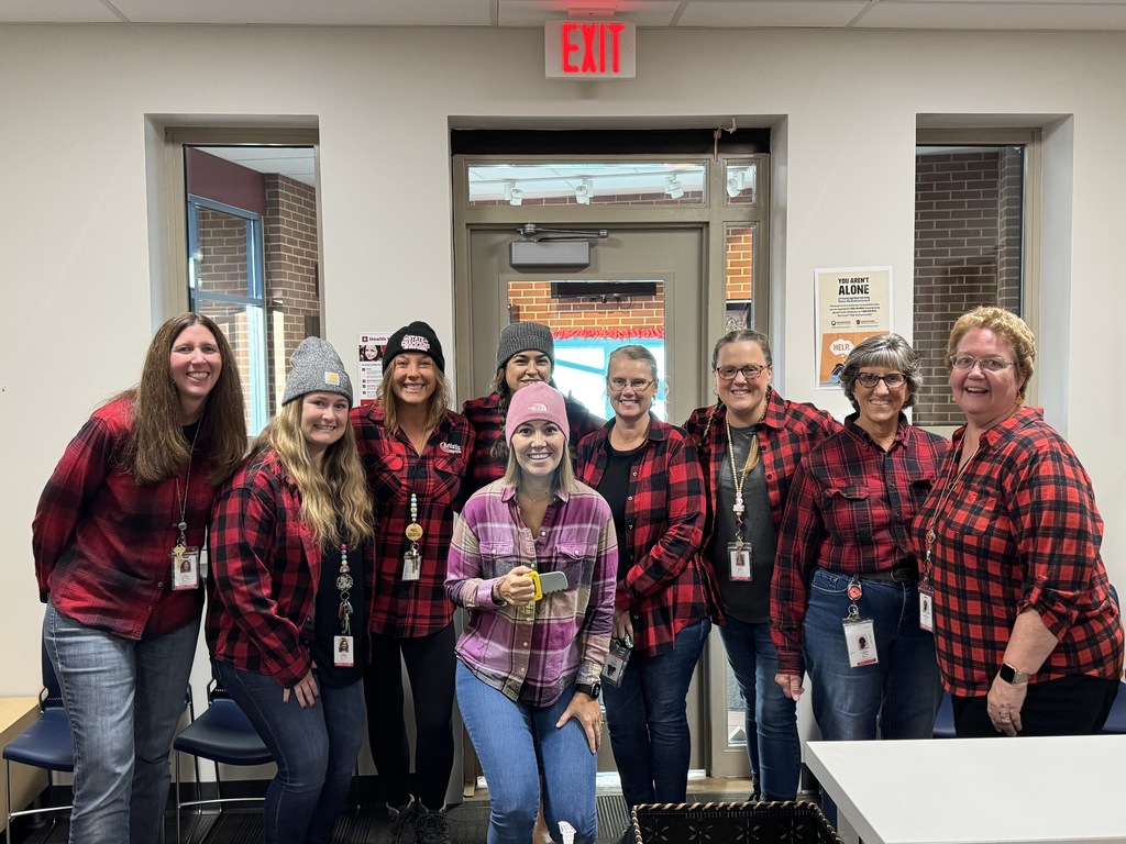 Group of female teachers wearing plaid shirts for lumberjack day