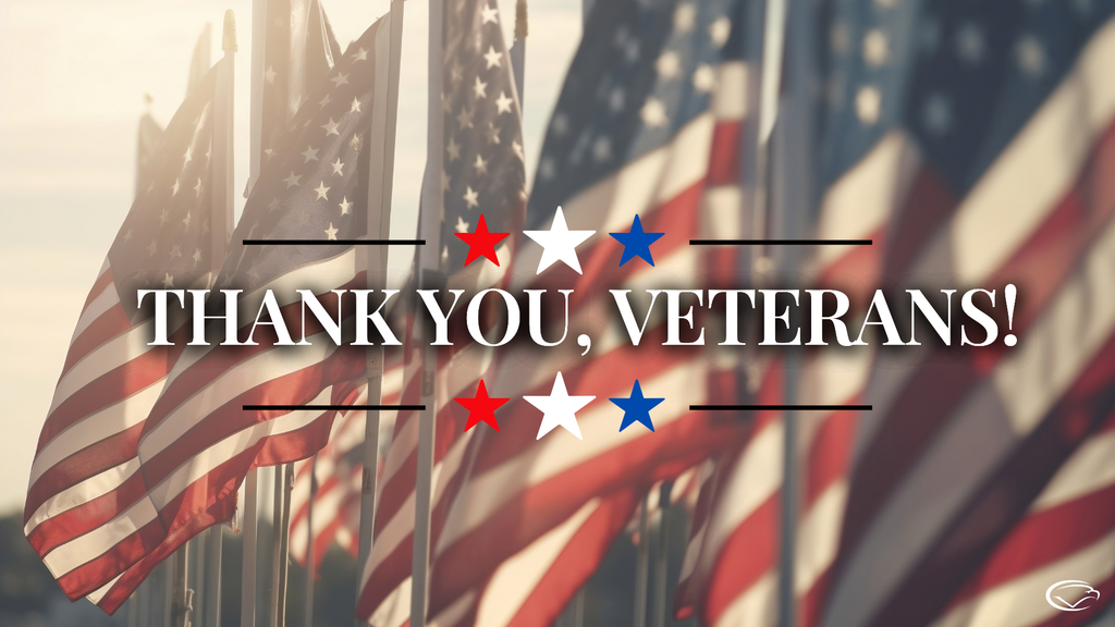 American flags in sunlight with text “Thank You, Veterans!” in bold letters, surrounded by red, white, and blue stars.