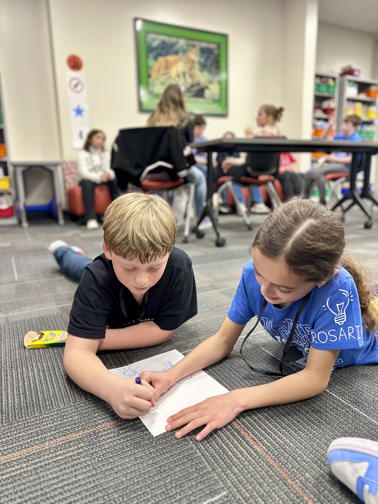 House Leaders from Winding Creek and Middlesex Elementary participate in a two and a crayon activity during their House Leader collaboration.