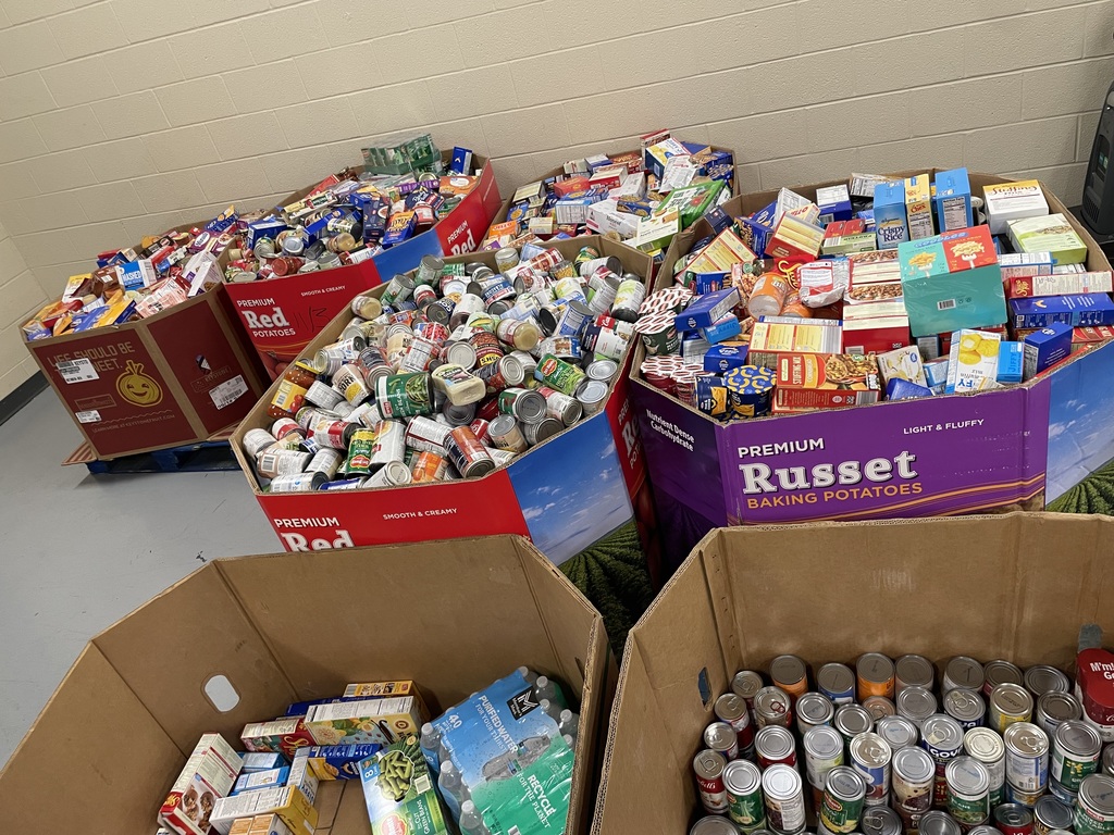 Large boxes filled with canned goods and packaged food collected for Mountain View Middle School’s canned food drive.