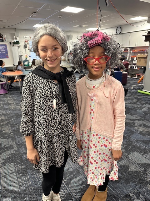 Two students dressed as elderly adults to celebrate the 100th day of school.