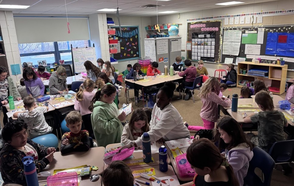 Classroom of kids working on papers