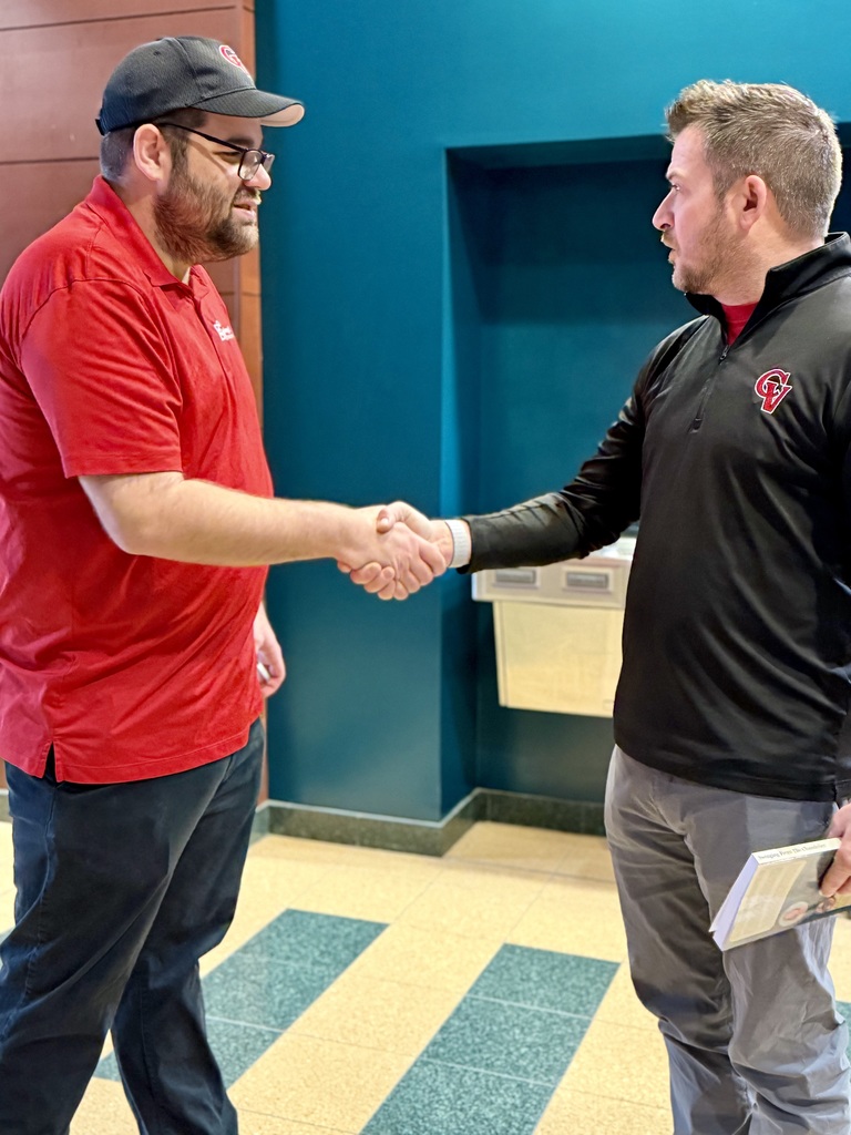 Ben Hartranft shakes hands with a CV staff member as they are discussing the powerful message he gave during a PD day.