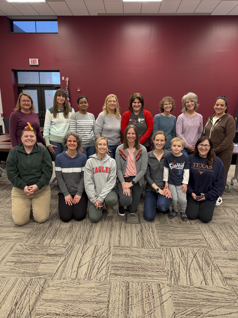 A group of volunteers pose for a picture after they prepared items for CV's Special Olympics.