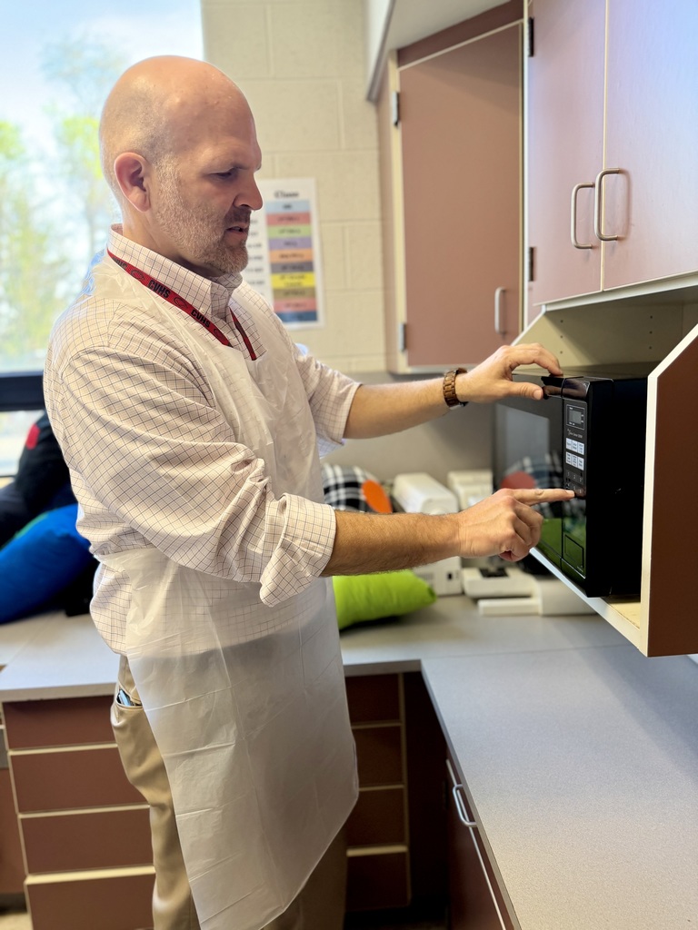Dr. Blanchard prepares a Jiffy Breakfast in the microwave during a 7th grade FCS class.