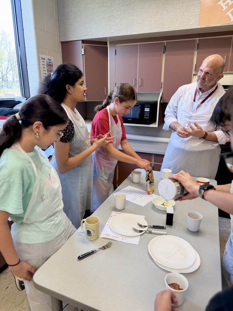 7th grade students prepare a Jiffy Breakfast with Dr. Blanchard in their FCS classroom.
