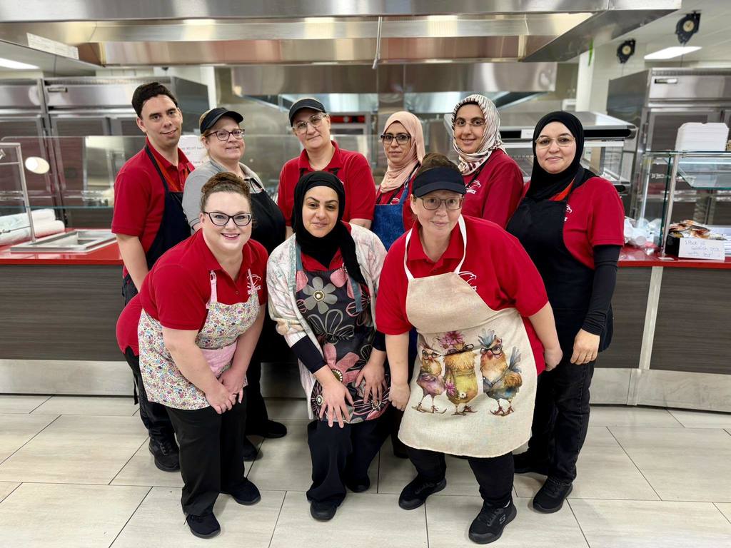 Mountain View Middle School's Food Services staff poses for a picture to celebrate National School Lunch Hero Day.