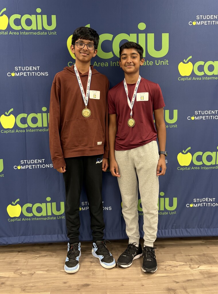 Eagle View Middle School students wearing medals at the Math 24 Tournament, with Sumukh Achal (1st place) and Vihaan Muddasani (2nd place).