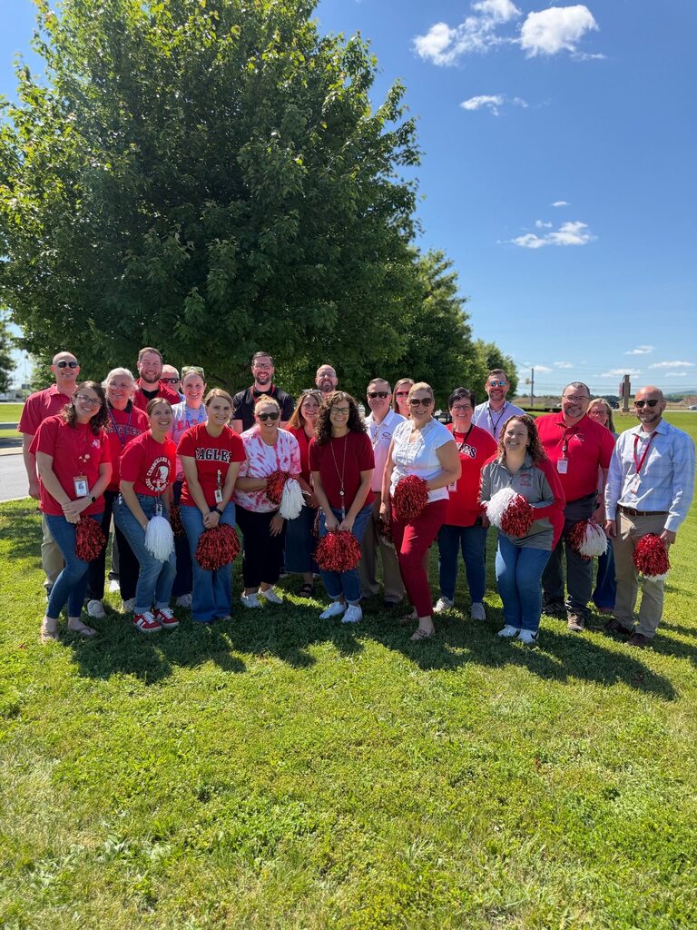 A group of District Office staff pose outside for a group picture on the last day of school.