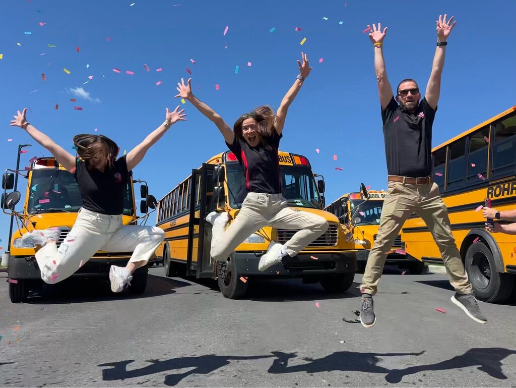 Eagle View administrations jump in the air and celebrate the last day of school.