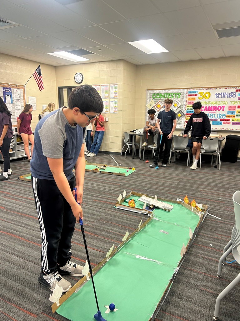 Student navigates a custom mini-golf hole built to explore geometry and physics concepts.