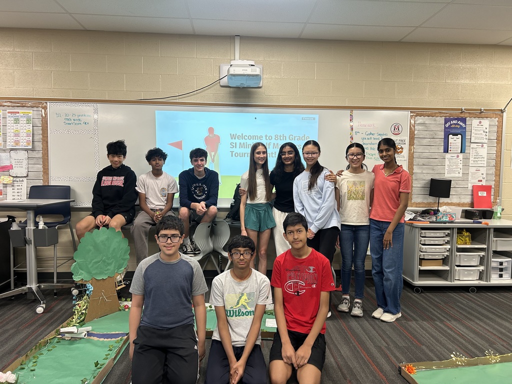 Mountain View Middle School 8th grade students gather for a group picture after testing their mini-golf course during an engineering unit.