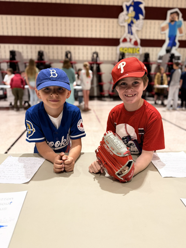 Monroe Elementary second-graders dressed as Jackie Robinson display their baseball-themed wax museum exhibits during the school's second-grade Wax Museum.