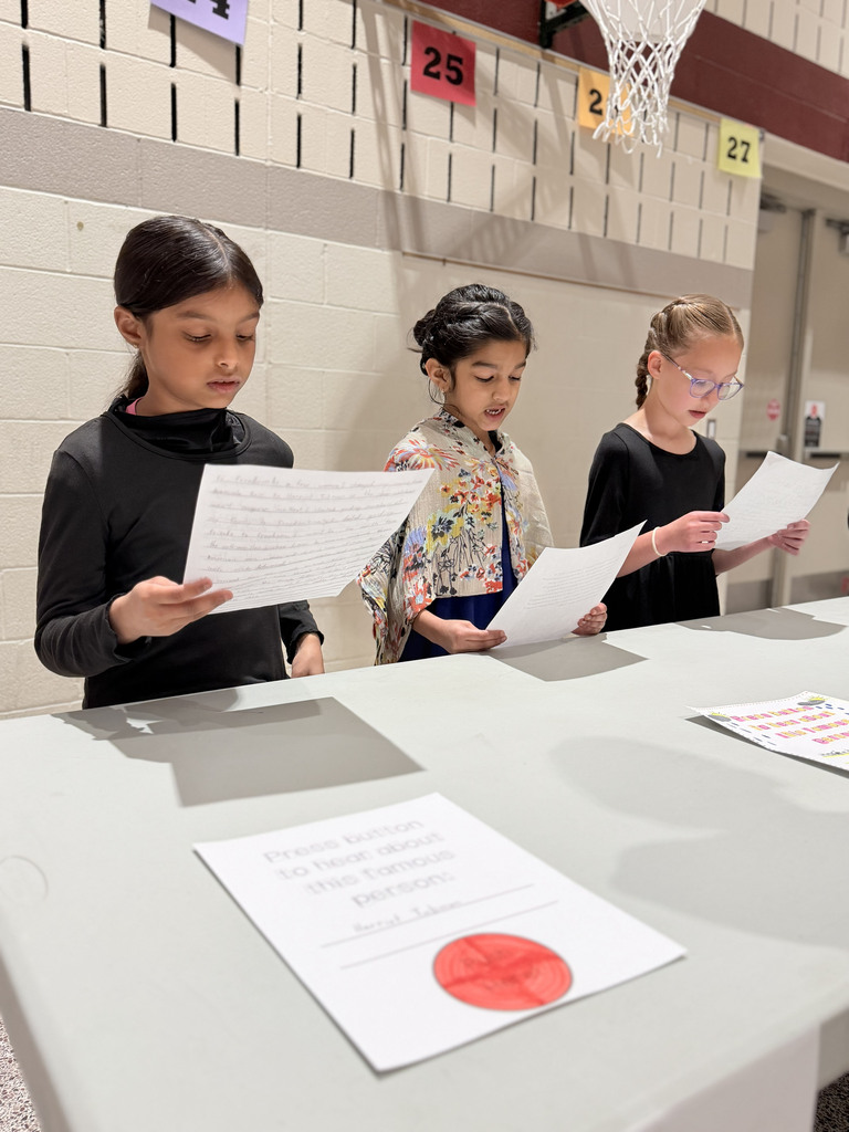 Students portraying Harriet Tubman share their Wax Museum presentations at Monroe Elementary's second-grade event.