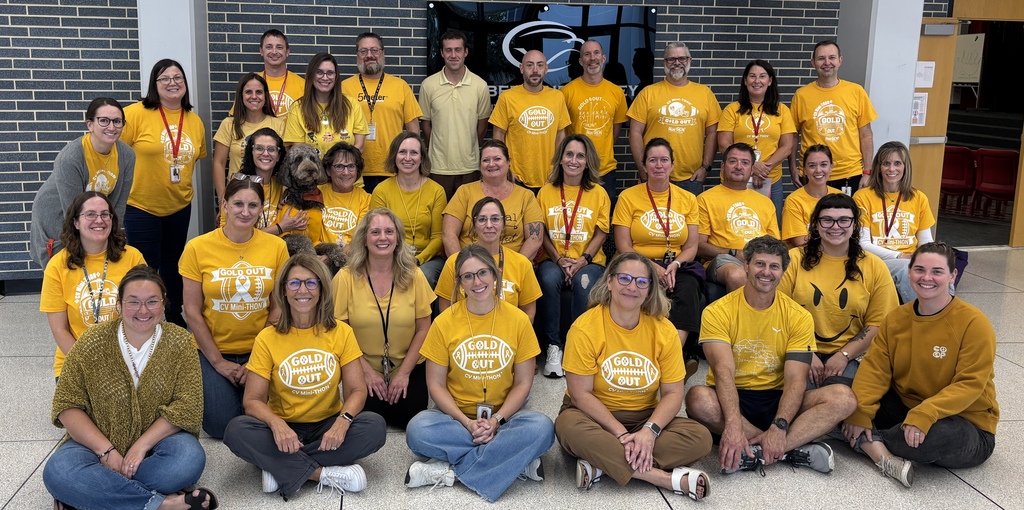 CV9 staff members show their support for Childhood Cancer buy wearing their gold shirts for tonight's Gold Out football game.