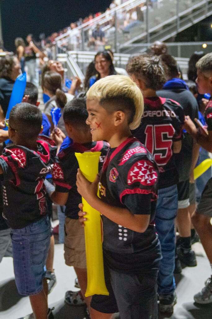 student wearing football jersey
