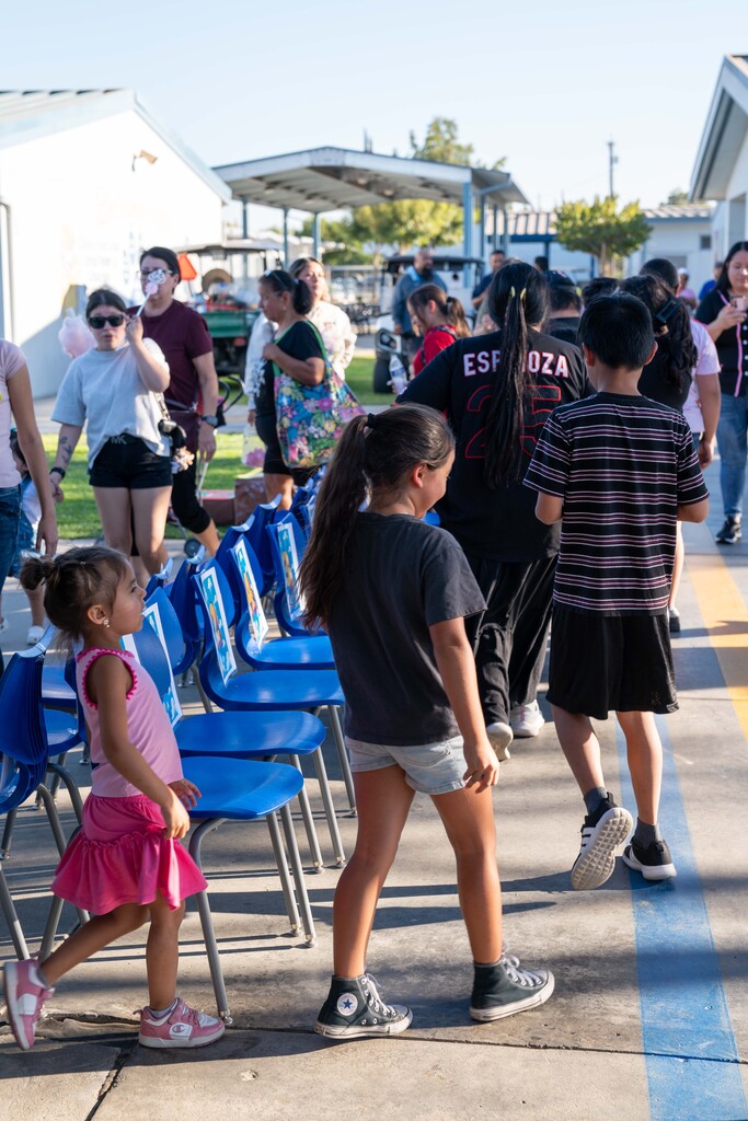 Attendees participate in the cake walk/musical chairs activity at the Cutler School carnival