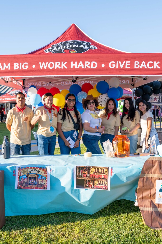 Staff is photographed in their costumes at their booth at the Cutler School Carnival