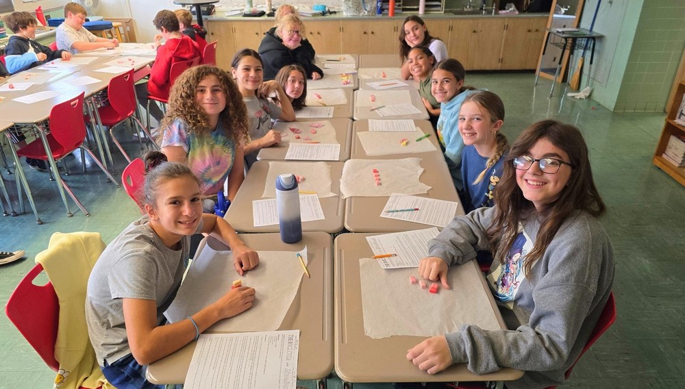 Students prepare for rock candy study.