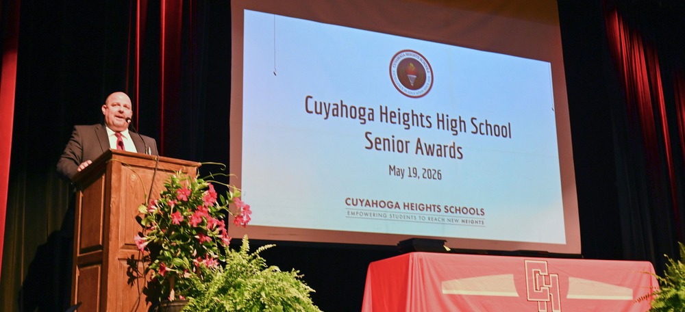 Principal Scott DeTray at podium.