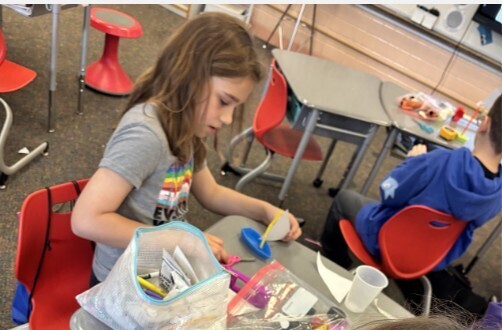 Girl making a rocket.