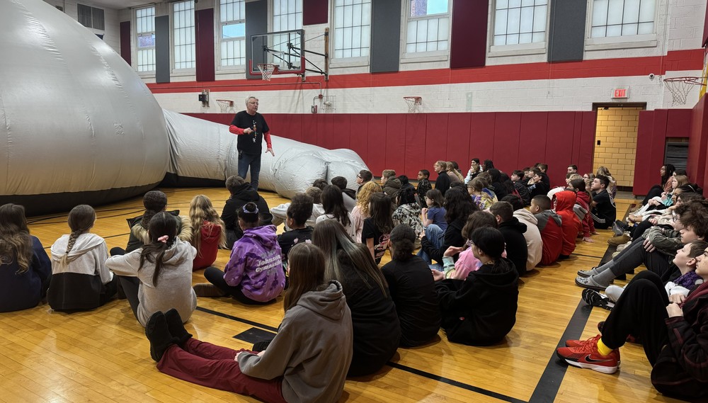 Students alongside SkyDome in gymnasium
