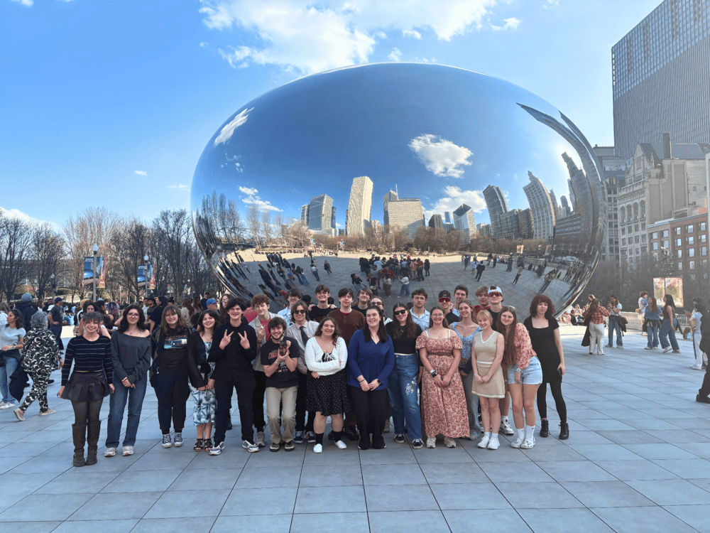 Students pose in front of "The Bean" in Chicago's Milennieum Park. 