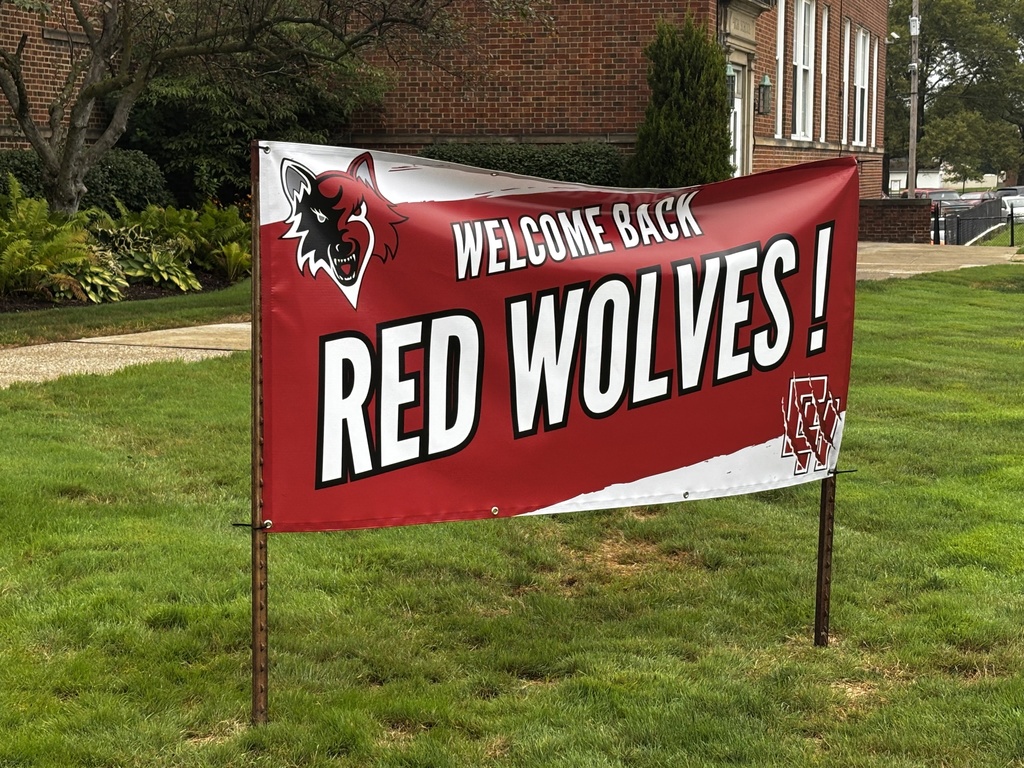 Welcome back Red Wolves sign in front of the high school