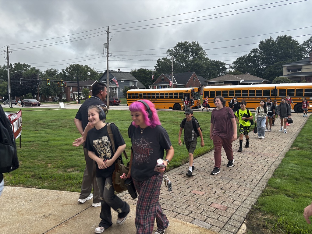 Students getting off of busses