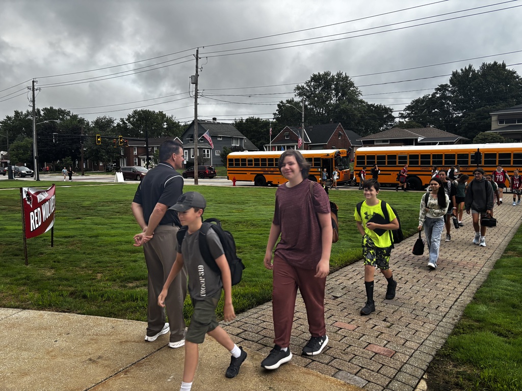 Students getting off of busses